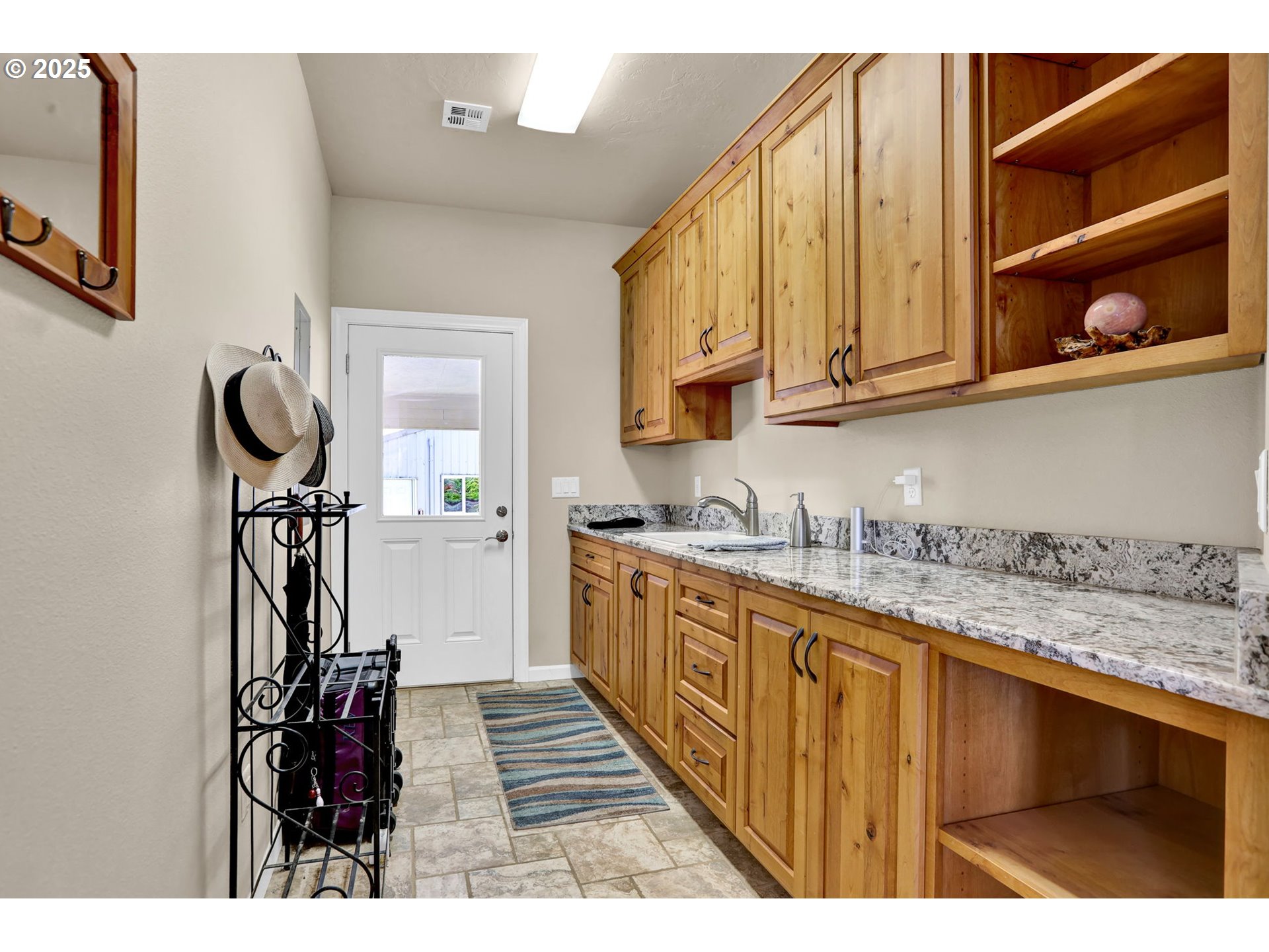 485 Andrews Road Yoncalla, OR 97499 - Photo 18 of 46 a kitchen with granite countertop a sink a stove and cabinets