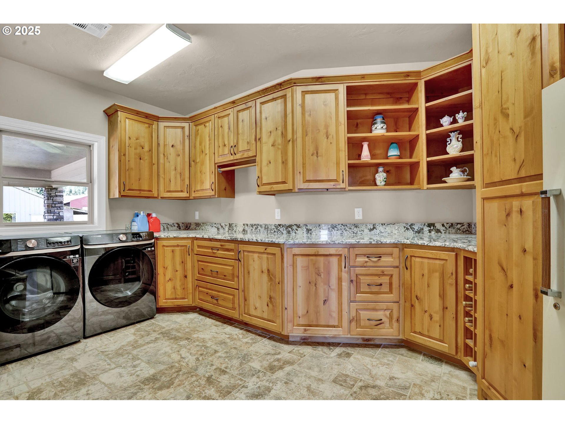 485 Andrews Road Yoncalla, OR 97499 - Photo 19 of 46 a kitchen with granite countertop a stove a sink and a microwave