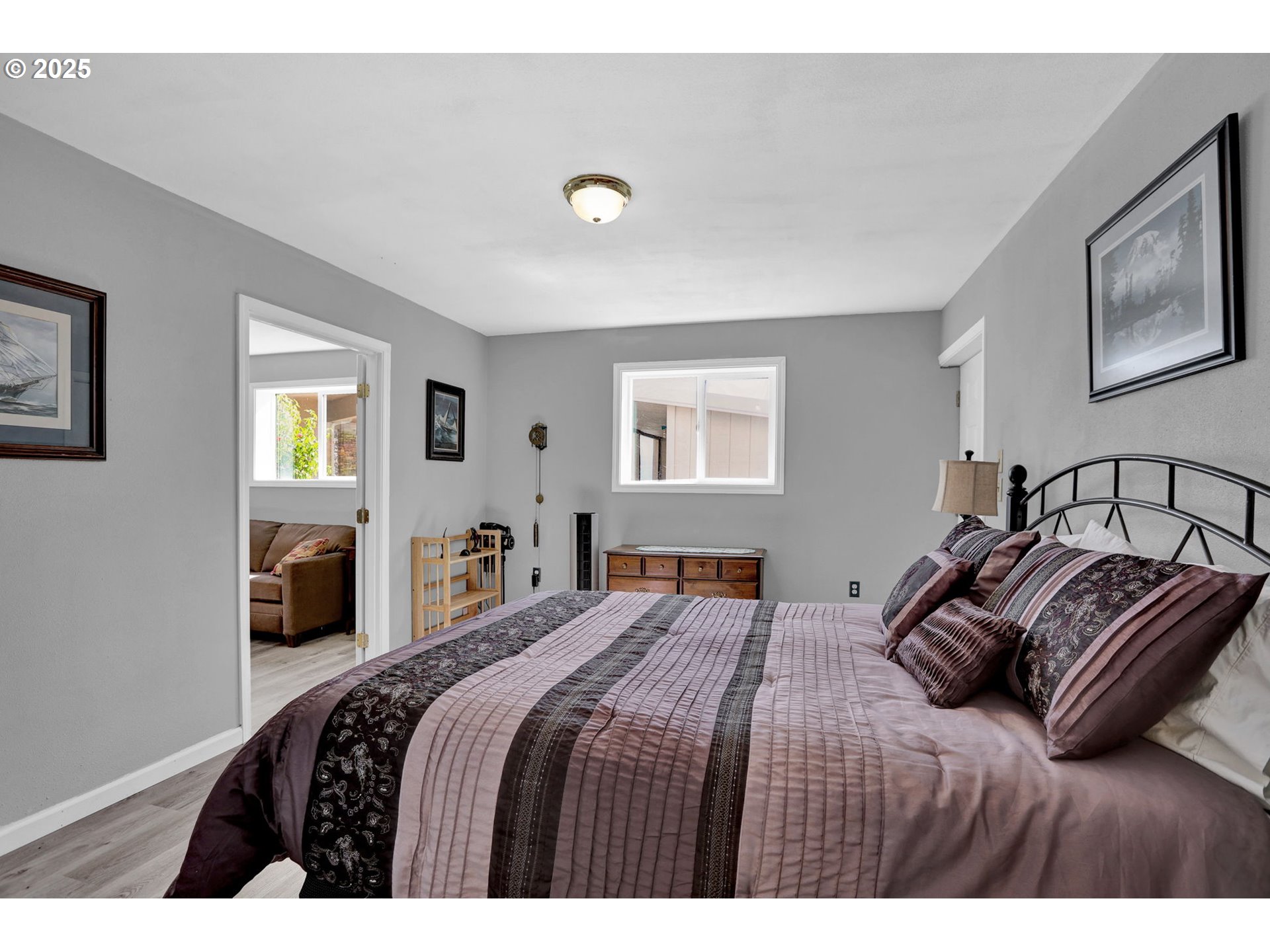 485 Andrews Road Yoncalla, OR 97499 - Photo 34 of 46 a bedroom with a large bed and a lamp