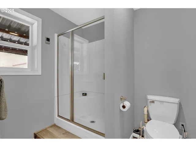 a front view of a house with a garden and patio