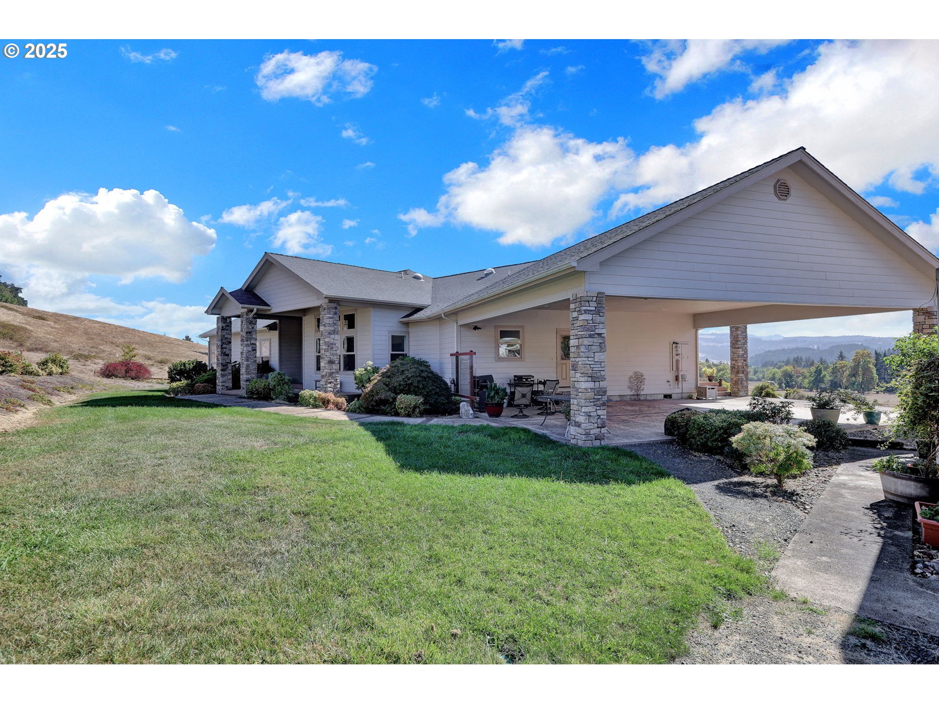 485 Andrews Road Yoncalla, OR 97499 - Photo 37 of 46 a front view of a house with a garden and patio