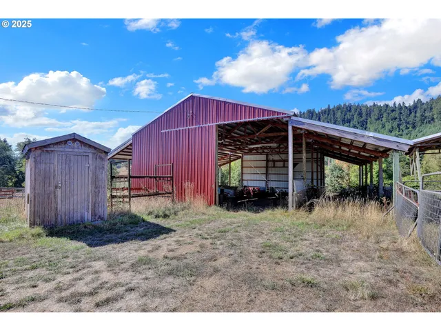 a bed room with a bed and a chair