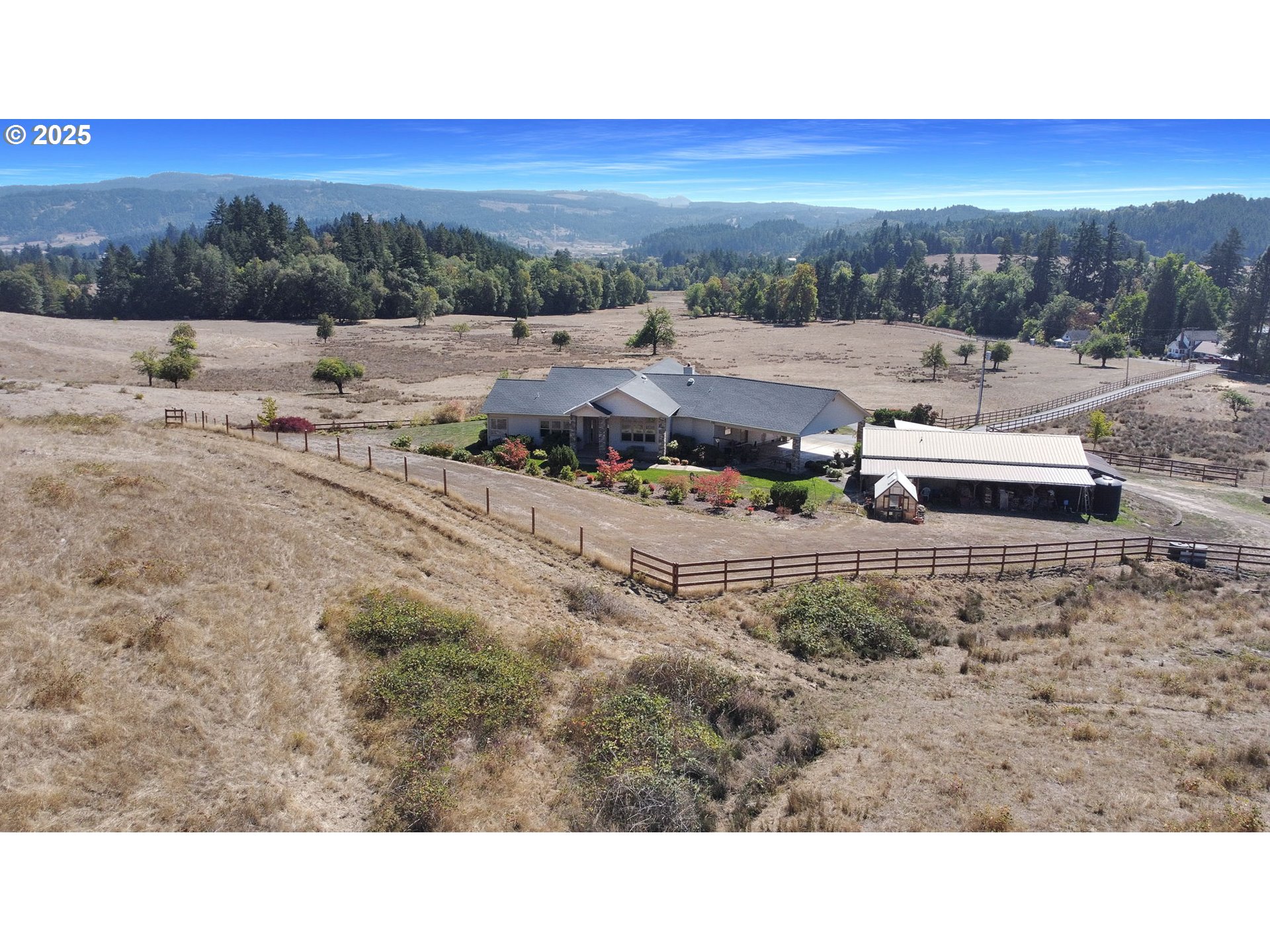 485 Andrews Road Yoncalla, OR 97499 - Photo 7 of 46 a view of a town with big trees