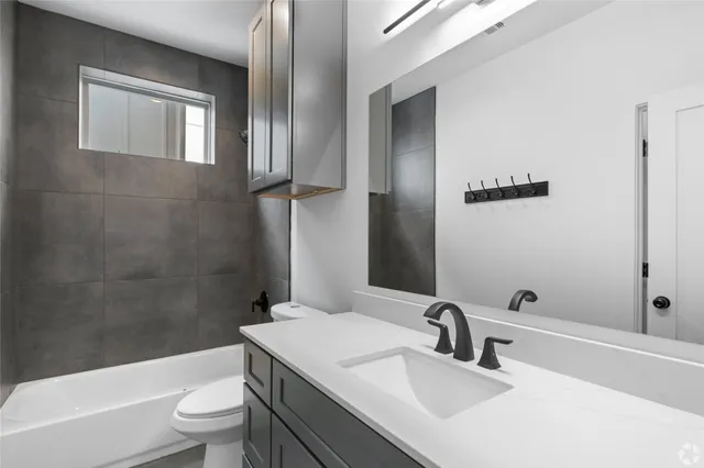 a view of a house with backyard and porch