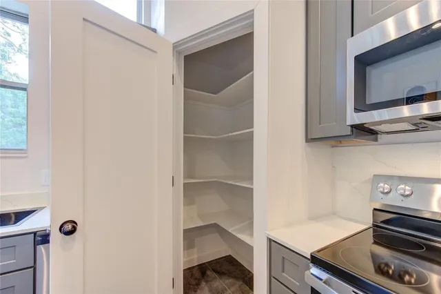 a kitchen with appliances and cabinets