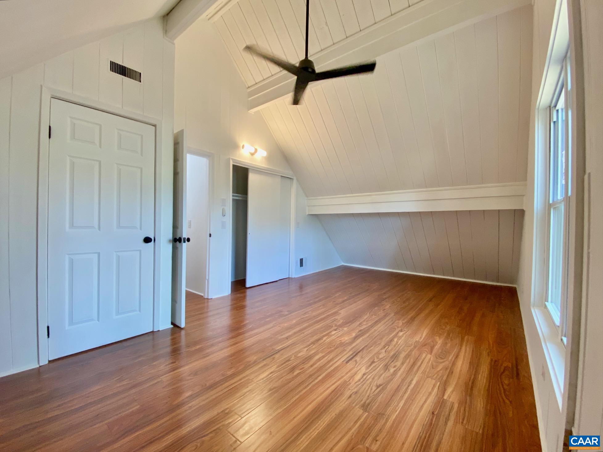 24 Tanglewood Road Palmyra, VA 22963 - Photo 14 of 23 a view of a room with wooden floor and a ceiling fan