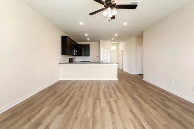 a view of a kitchen with a sink and a microwave