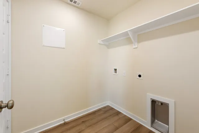 a view of a small space with wooden floor