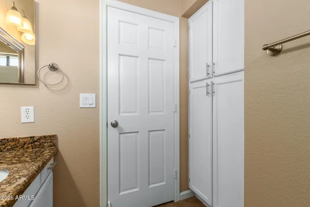 a view of a kitchen from the hallway