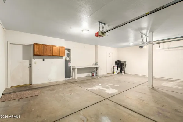 a view of a livingroom with a refrigerator and a cabinets