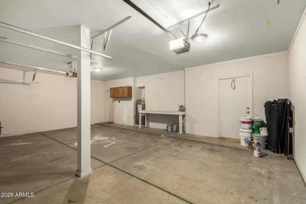 a view of a livingroom with furniture and a fan