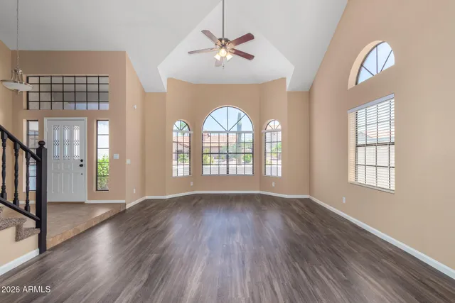 a view of an entryway with wooden floor and a window