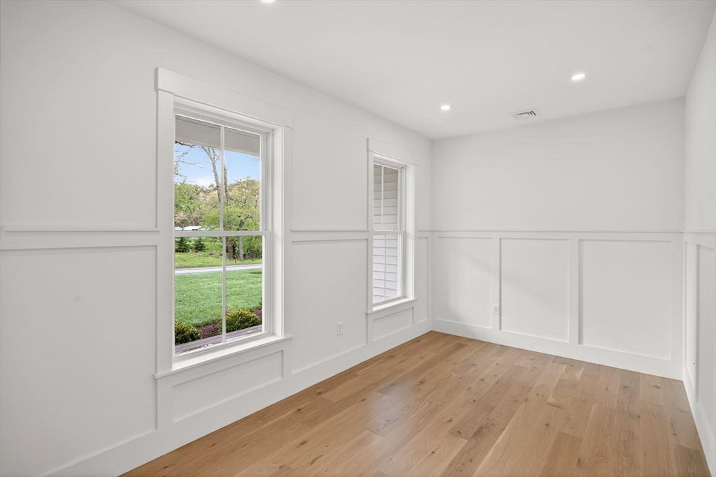132 Great Western Road Harwich, MA 02645 - Photo 22 of 42 an empty room with wooden floor and windows
