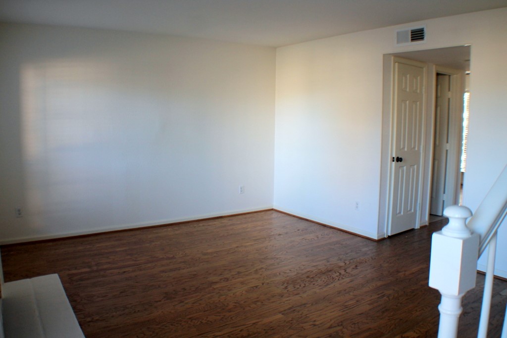 5100 Allendale Road, Unit 207 Houston, TX 77017 - Photo 5 of 34 a view of an empty room with wooden floor and a window