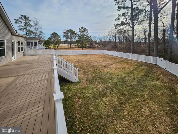 a swimming pool with outdoor space and seating area
