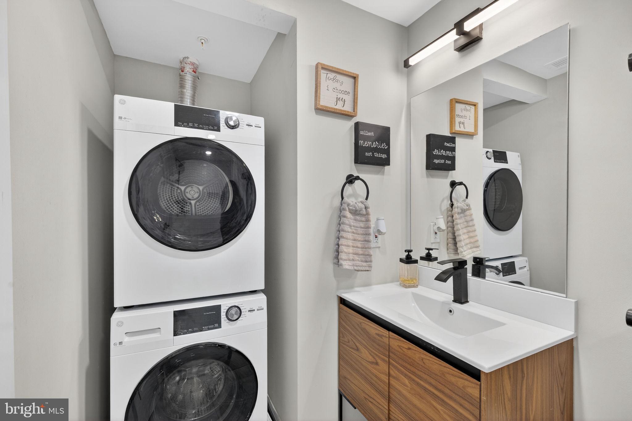 919 12th Street Northeast, Unit 305 Washington, DC 20002 - Photo 21 of 31 a bathroom with a sink and a mirror