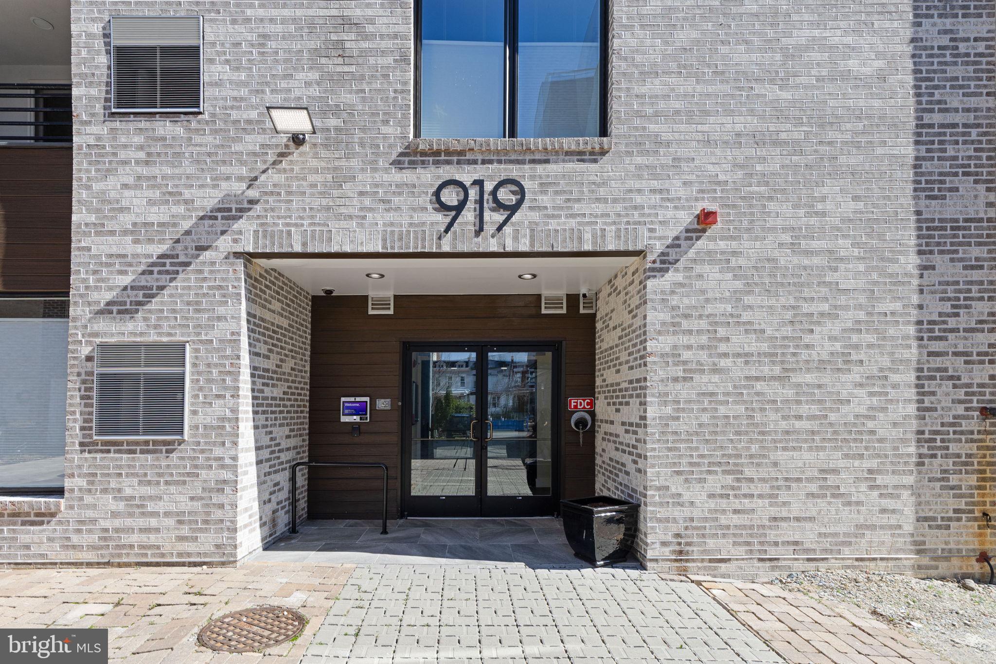 919 12th Street Northeast, Unit 305 Washington, DC 20002 - Photo 27 of 31 a view of a brick entrance of the building