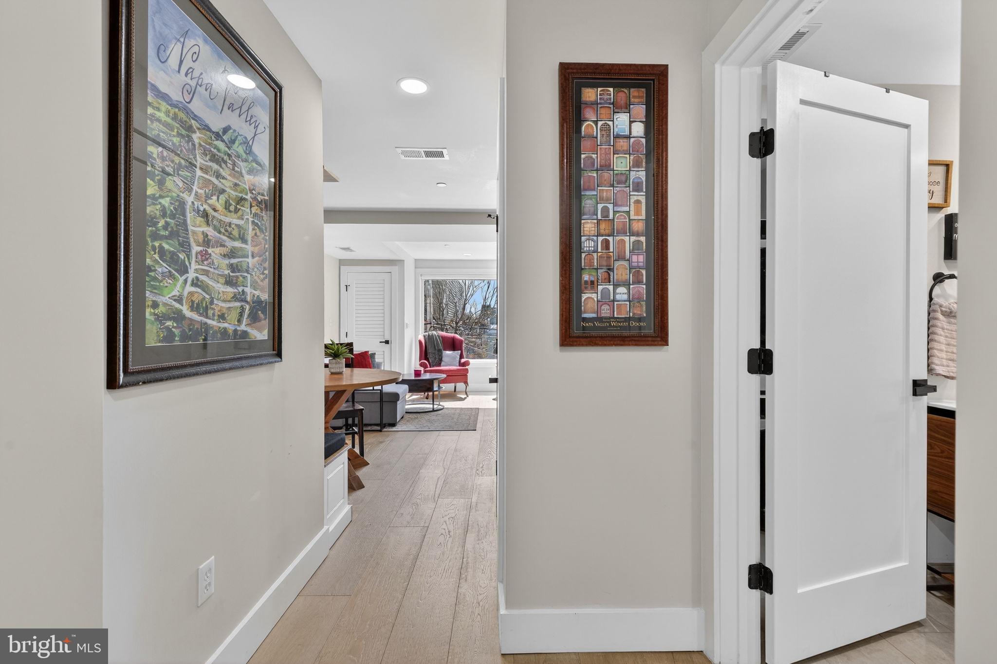 919 12th Street Northeast, Unit 305 Washington, DC 20002 - Photo 3 of 31 a living room with furniture and a potted plant
