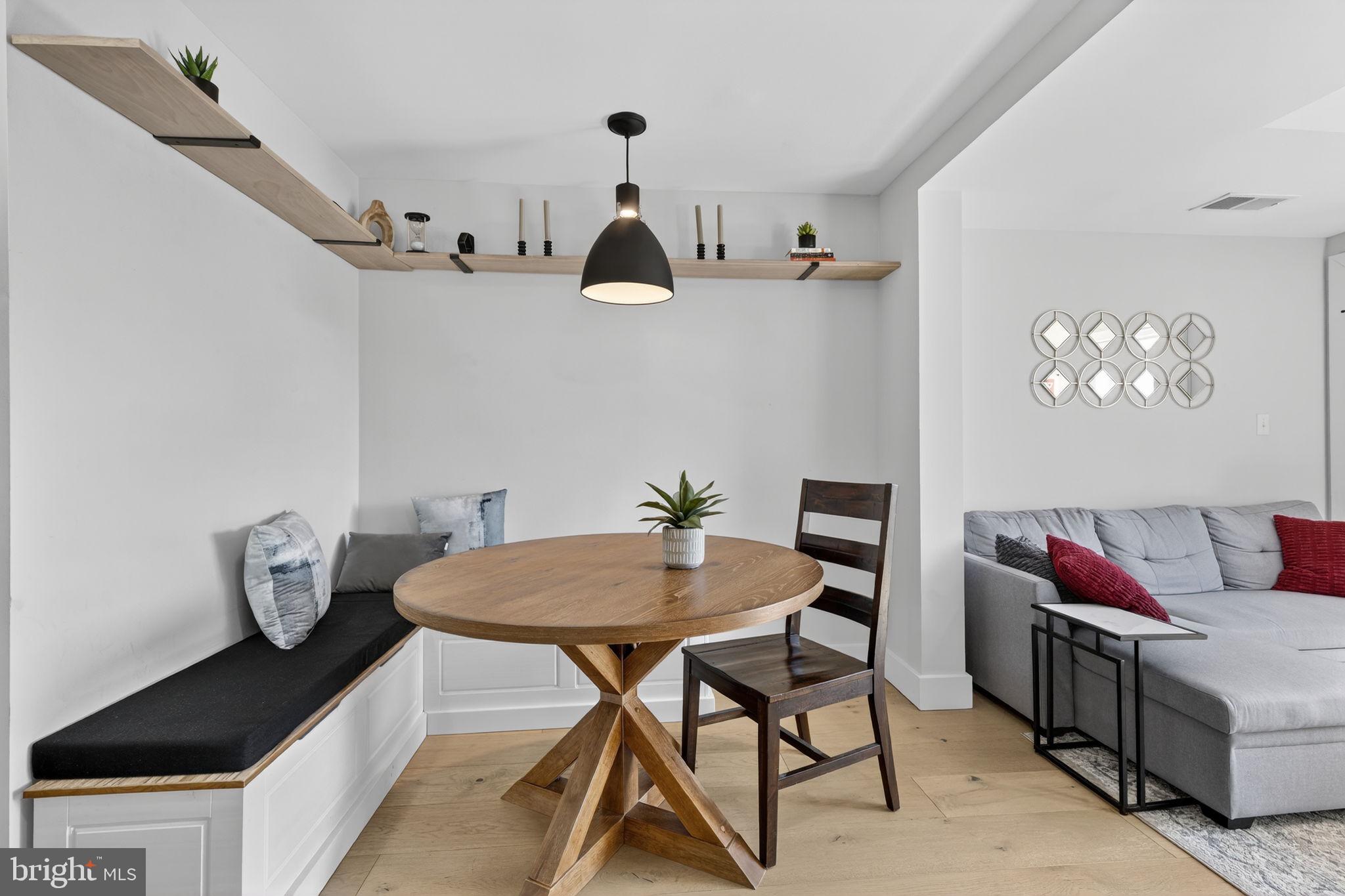 919 12th Street Northeast, Unit 305 Washington, DC 20002 - Photo 7 of 31 a view of a dining room with furniture and wooden floor