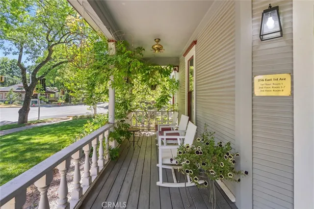 a view of an entryway with wooden floor and windows