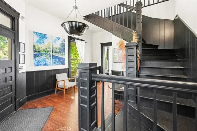 a dining room with furniture and a large window
