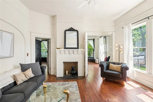 a view of hallway with furniture and a window
