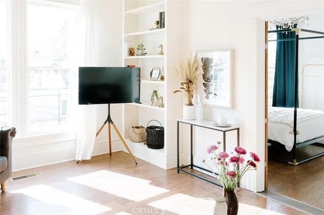 a living room with furniture and a flat screen tv