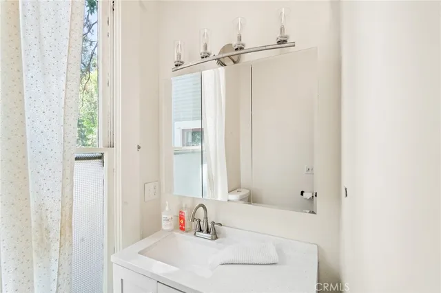a bedroom with a bed and a flat tv screen