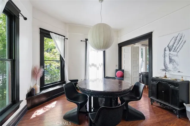 a dining room with furniture and window