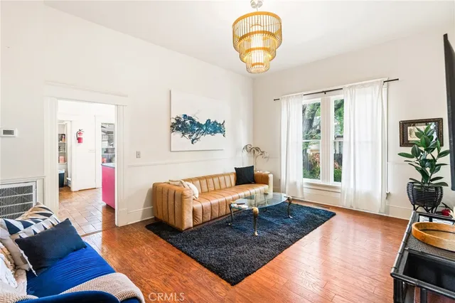 a living room with furniture rug and window