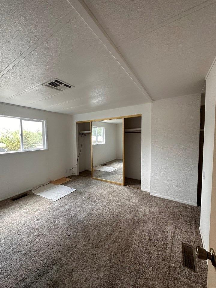39678 Fresno Flats Road, Unit 39 Oakhurst, CA 93644 - Photo 21 of 34 an empty room with windows