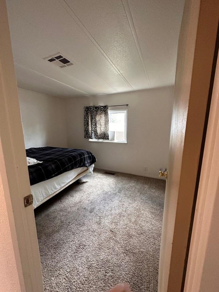 39678 Fresno Flats Road, Unit 39 Oakhurst, CA 93644 - Photo 22 of 34 an empty room with windows