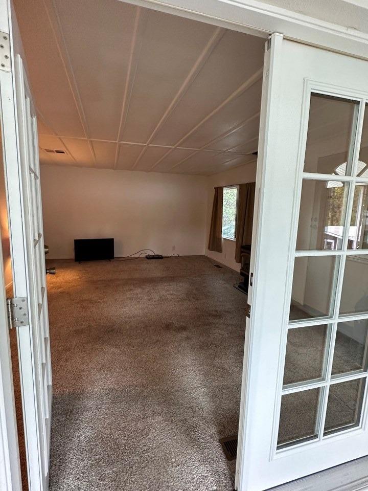 39678 Fresno Flats Road, Unit 39 Oakhurst, CA 93644 - Photo 25 of 34 a view of a big room with wooden floor and windows
