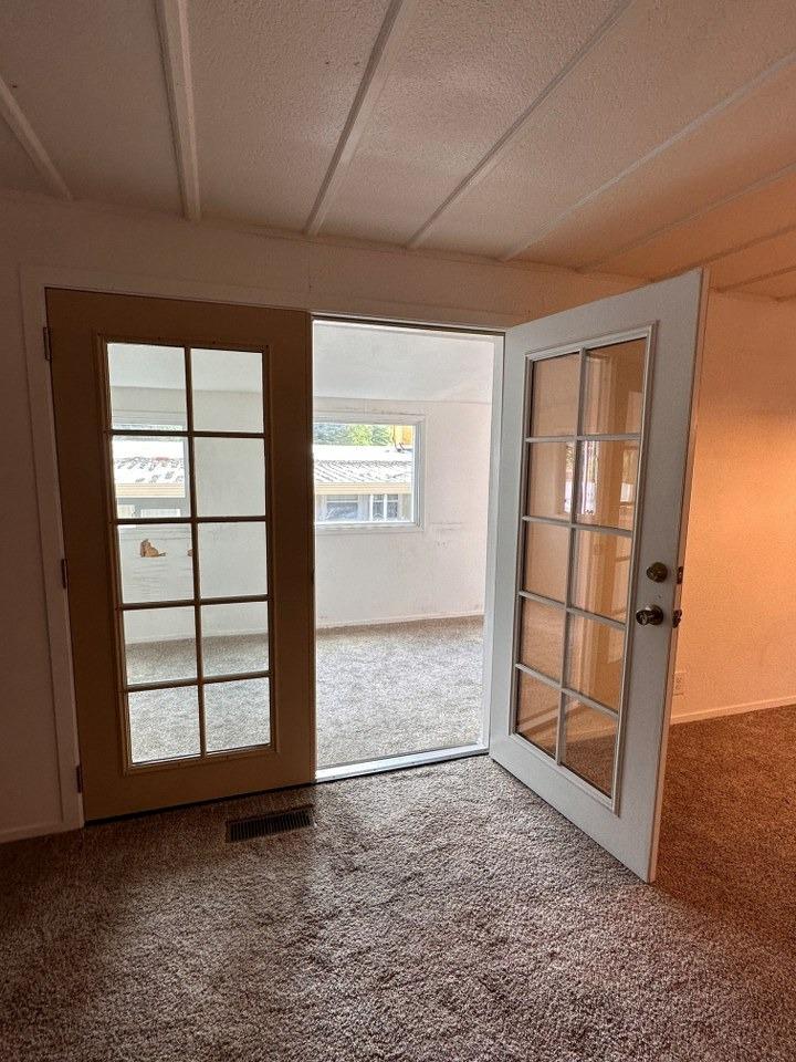 39678 Fresno Flats Road, Unit 39 Oakhurst, CA 93644 - Photo 26 of 34 an empty room with windows