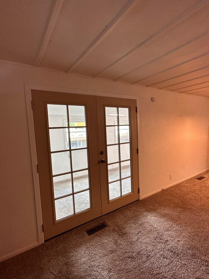 39678 Fresno Flats Road, Unit 39 Oakhurst, CA 93644 - Photo 27 of 34 an empty room with windows