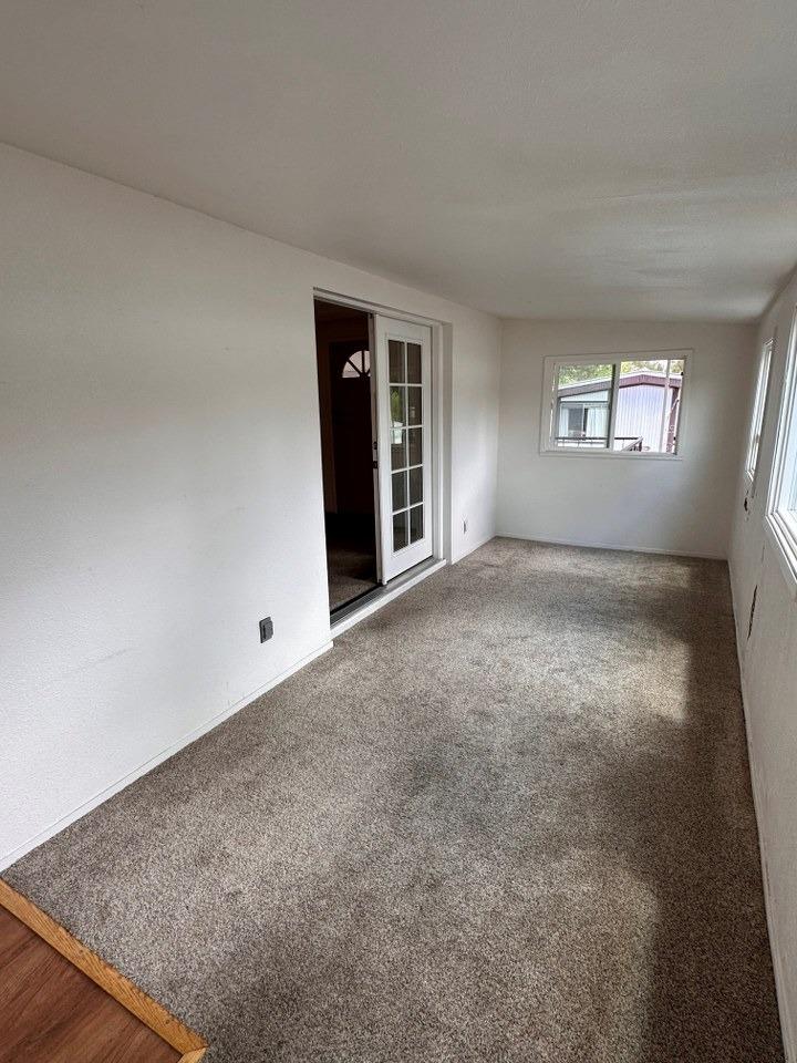 39678 Fresno Flats Road, Unit 39 Oakhurst, CA 93644 - Photo 29 of 34 an empty room with windows