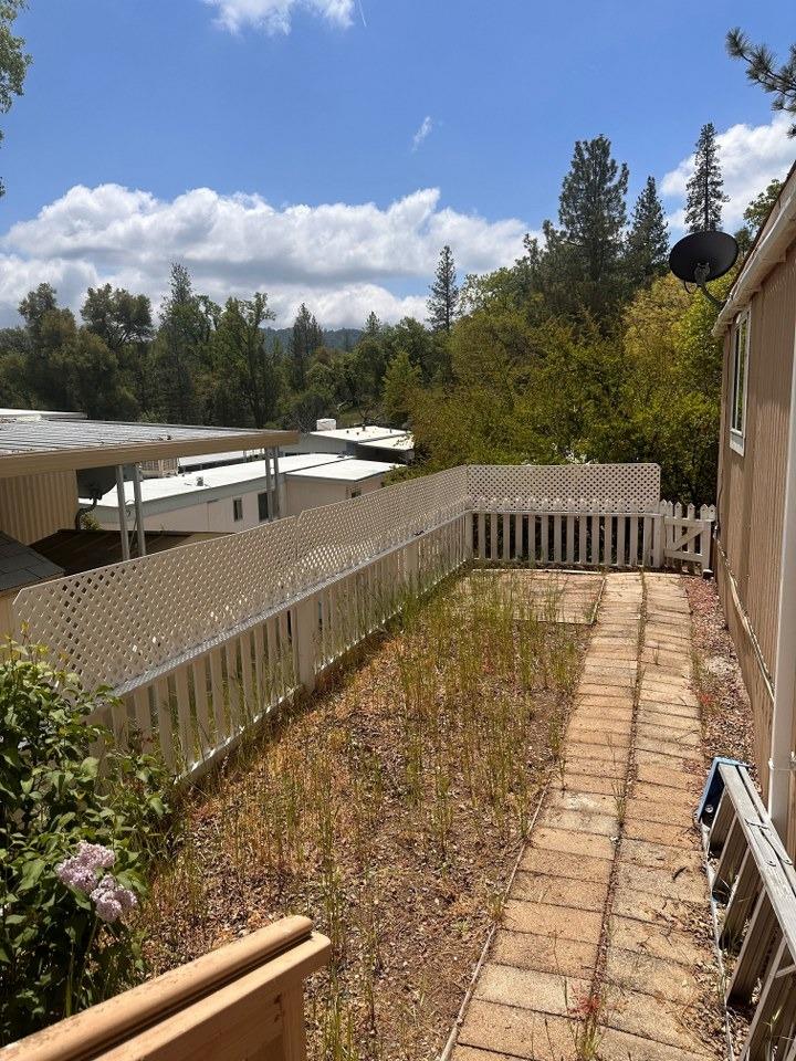 39678 Fresno Flats Road, Unit 39 Oakhurst, CA 93644 - Photo 31 of 34 a view of a swimming pool with a terrace