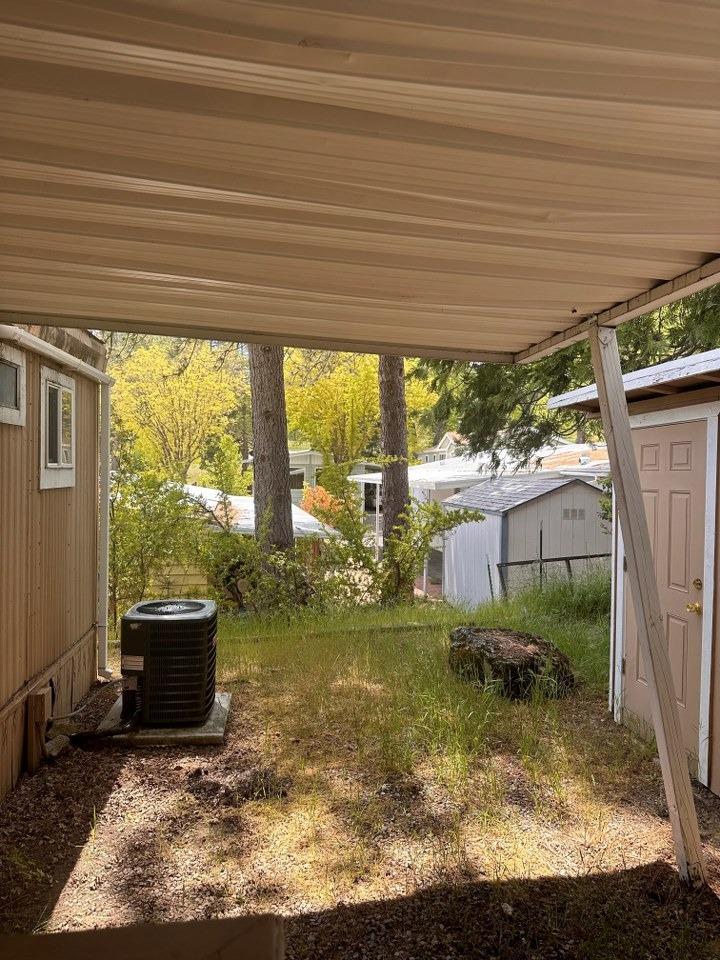 39678 Fresno Flats Road, Unit 39 Oakhurst, CA 93644 - Photo 32 of 34 a living room with a large window