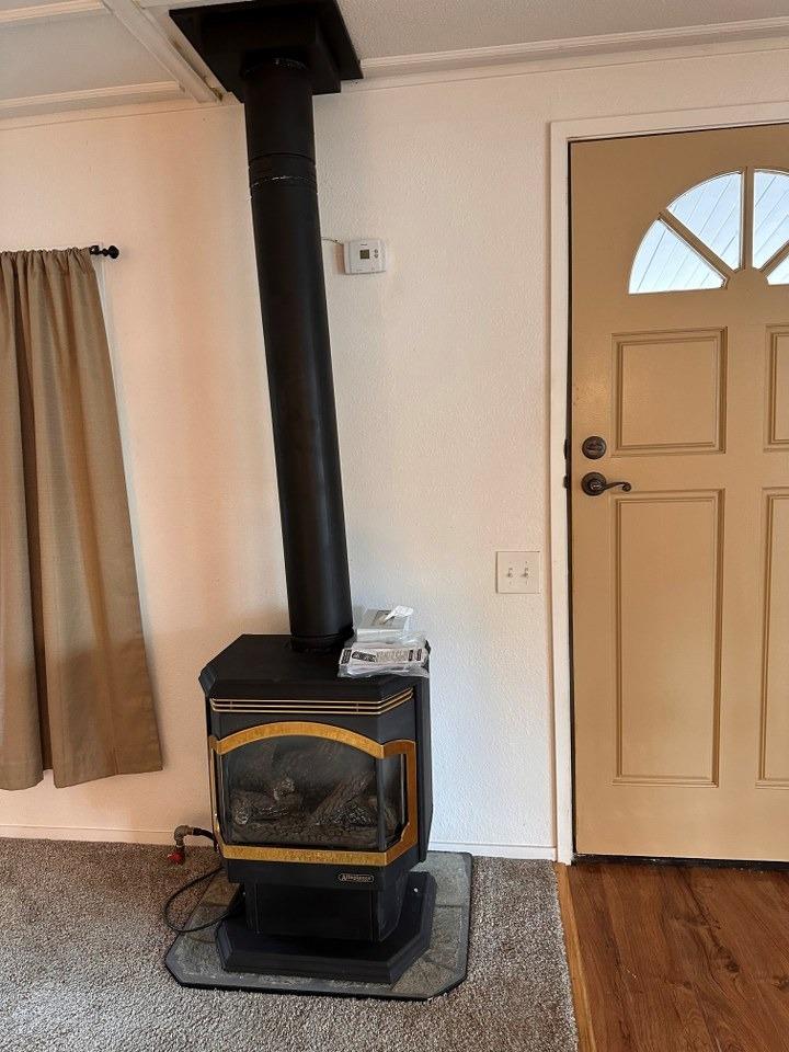 39678 Fresno Flats Road, Unit 39 Oakhurst, CA 93644 - Photo 4 of 34 a living room with a mirror and a wooden floor