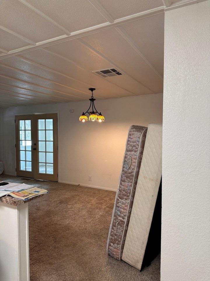 39678 Fresno Flats Road, Unit 39 Oakhurst, CA 93644 - Photo 7 of 34 a view of an empty room with windows