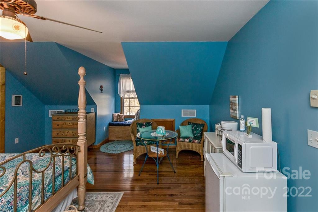 129 Moonlight Drive Sylva, NC 28779 - Photo 19 of 41 a living room with furniture and a dining table