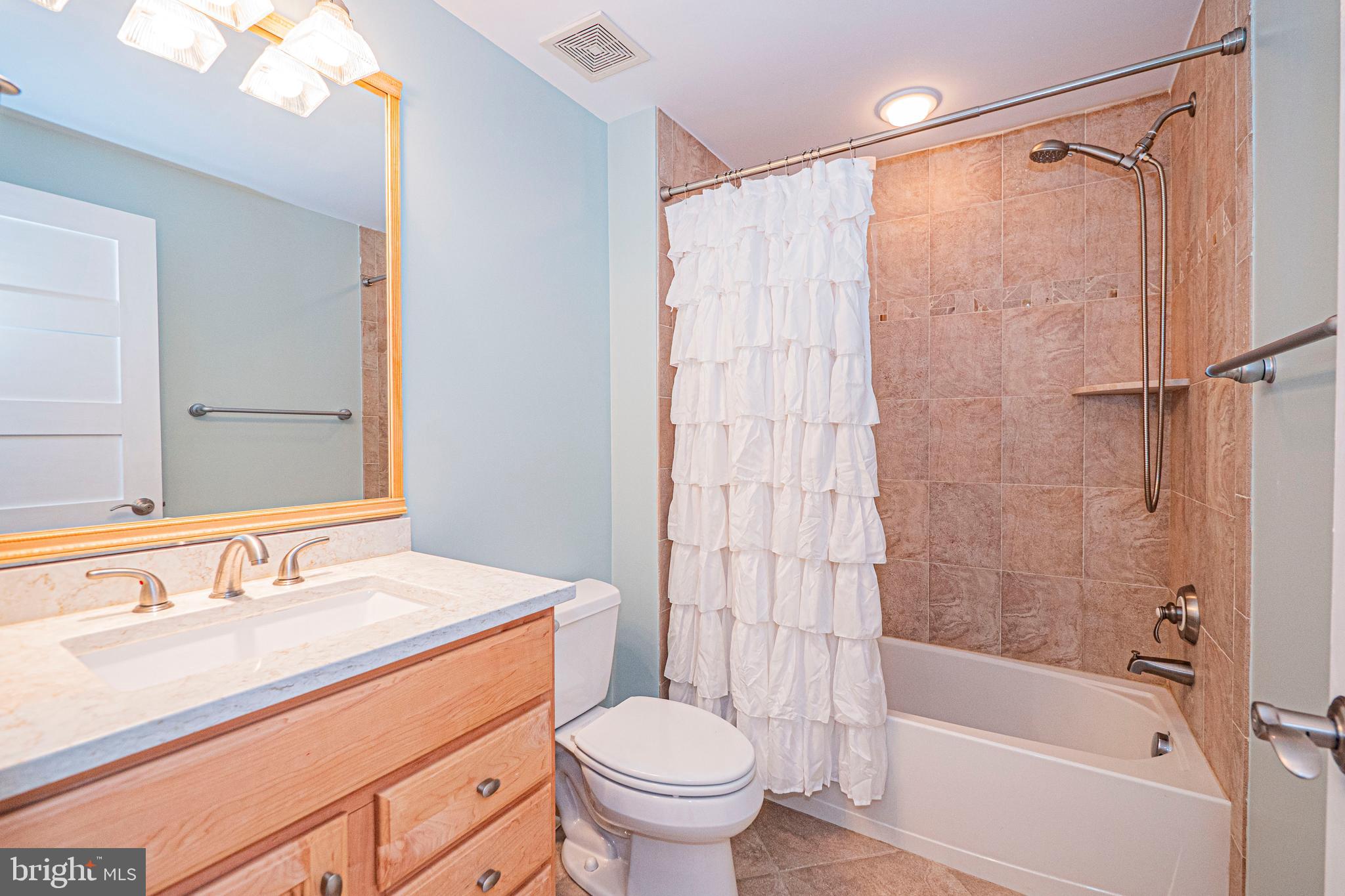5448 Edsall Ridge Place Alexandria, VA 22312 - Photo 36 of 52 a bathroom with a sink toilet and shower