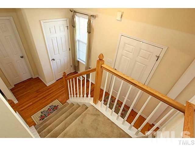 247 Roping Horn Way Willow Spring, NC 27592 - Photo 8 of 14 a view of a balcony with wooden floor