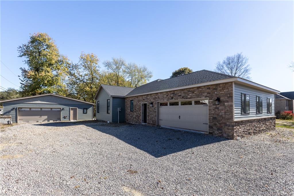 155 Edgewood Street Aliquippa, PA 15001 - Photo 2 of 45 a view of a house with a large tree and wooden fence