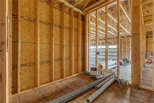 a view of an empty room with windows