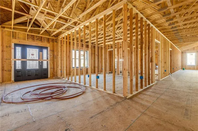 a view of a porch with a table and chairs