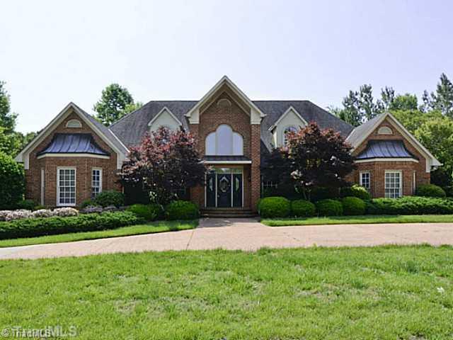 8231 Stafford Mill Road Oak Ridge, NC 27310 - Photo 1 of 16 Exterior Front. Your Oak Ridge Oasis awaits! Privacy is assured with this double lot surrounded by mature landscaping and detailed brick privacy walls. The circular drive with inlaid brick is the finest welcome to your private estate. A total of 7 garage spaces!