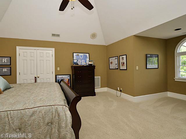 8231 Stafford Mill Road Oak Ridge, NC 27310 - Photo 14 of 16 3rd Bedroom. Located upstairs, this large bedroom has its own bath with tile floors, granite tops and step in tile shower. Another walk in closet for this bedroom awaits.