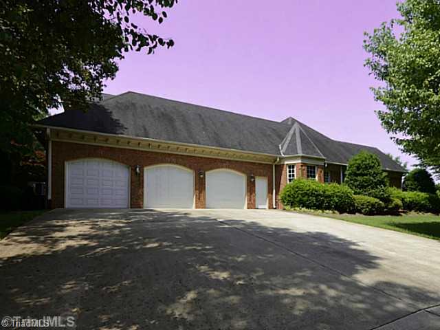 8231 Stafford Mill Road Oak Ridge, NC 27310 - Photo 3 of 16 Parking Lot/Garage. There is a spacious three car garage attached ro the home PLUS a detached four car garage that would be a great place for teens / future in law suite / or car aficionados workshop!