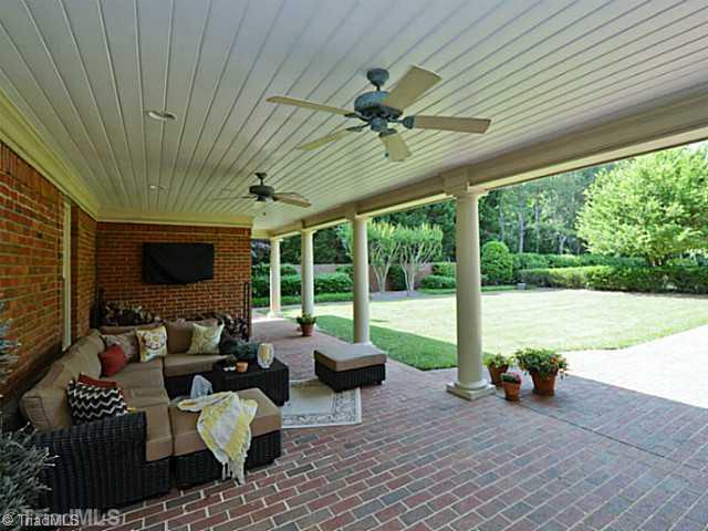 8231 Stafford Mill Road Oak Ridge, NC 27310 - Photo 4 of 16 Patio/Deck. What incredible space along the rear veranda/breezeway. this is the perfect spot for sipping your drink and watching the kids in the pool or at play. an entertainers dream.